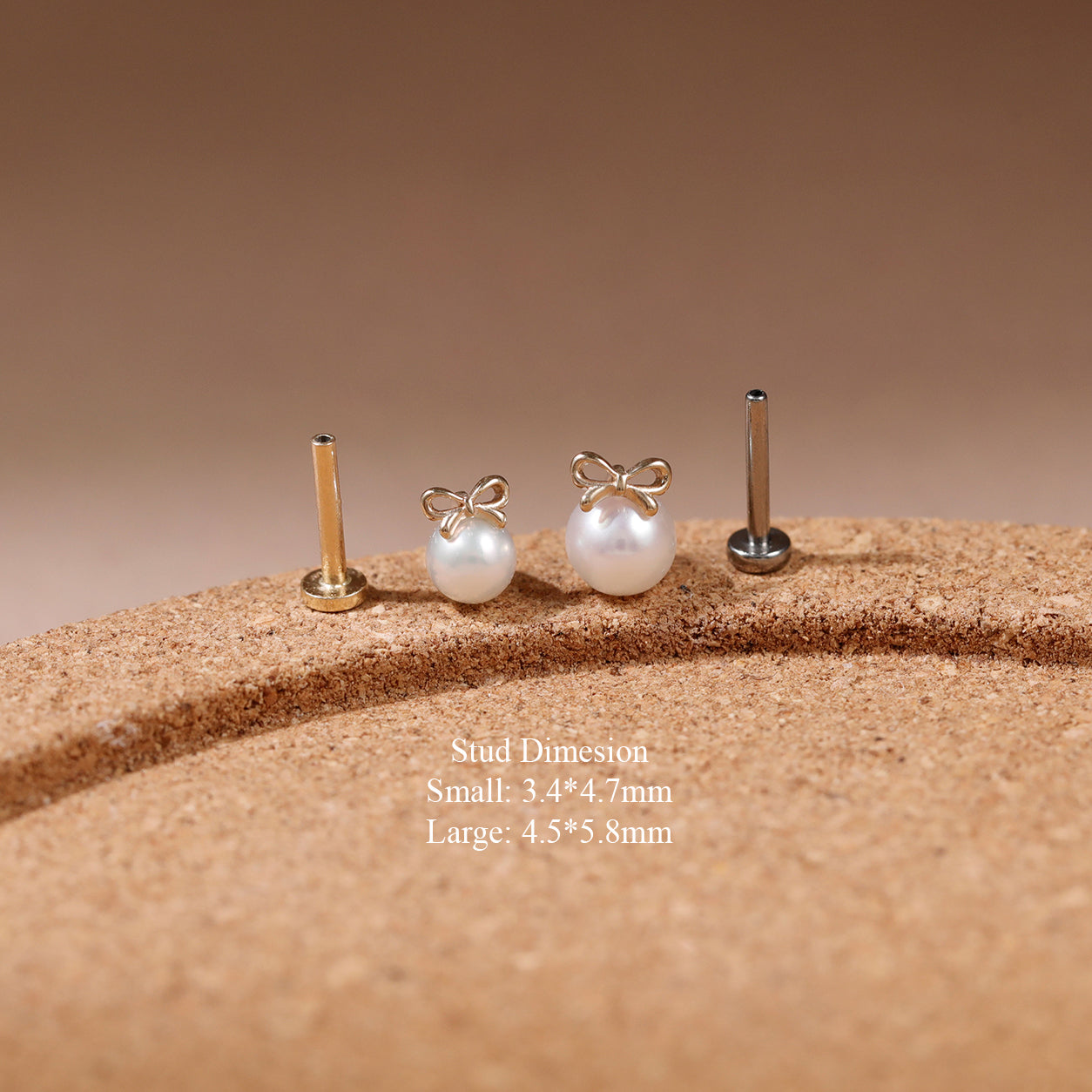 Two small pearl stud earrings with bow-shaped silver settings are displayed on a textured tan surface, alongside two plain metal post backings. White text below reads 'Sud Duresion Small: 3.