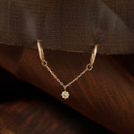 Gold-toned chain bar accessory with a small clear crystal charm, shown on a beige surface with overlaid dimension labels reading 30mm total, 2mm chain length, and 6*4mm crystal size.
