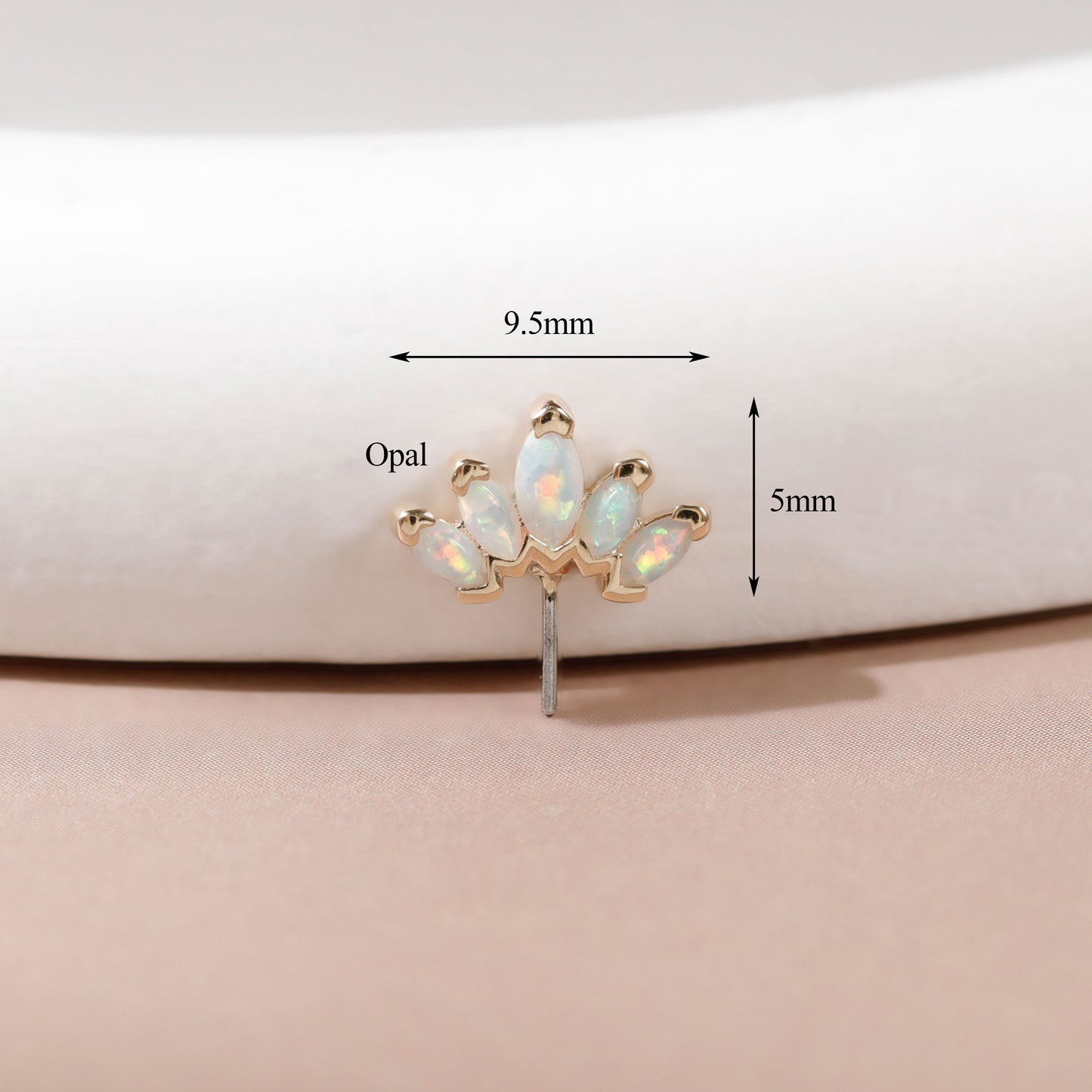 A small gold-toned stud earring with five iridescent opal stones arranged in a fan shape, shown on a soft beige surface with overlaid dimension arrows and labels reading 9.5mm and 5mm.