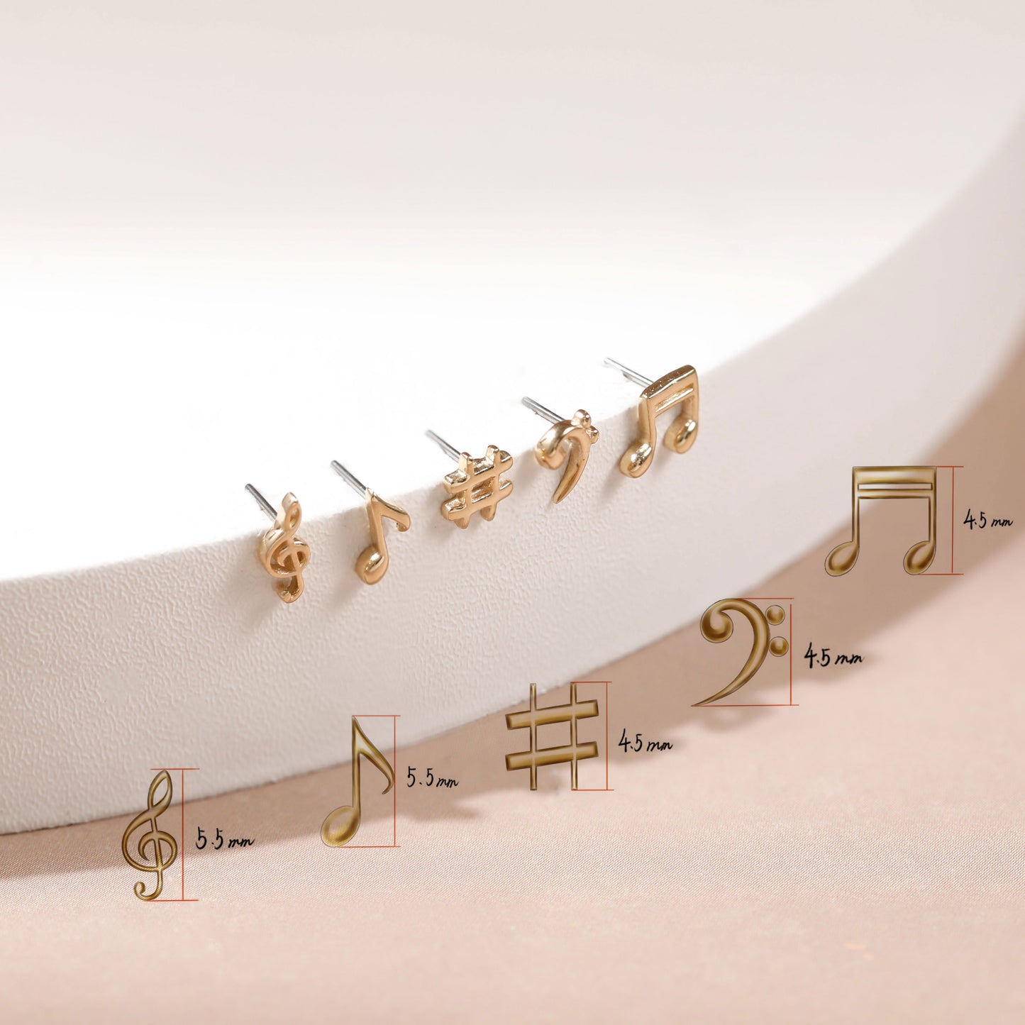 Four gold-tone music note stud earrings displayed on a white curved surface, with additional smaller size views and measurements labeled in millimeters below.